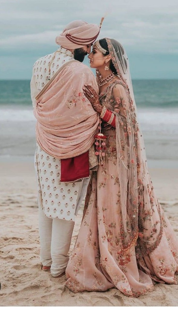 Armaan and Diya on the beach touching foreheads in wedding attire