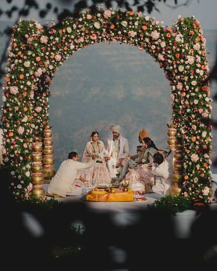 Misty Mountain Hill Station Wedding under a Grand Floral Arch